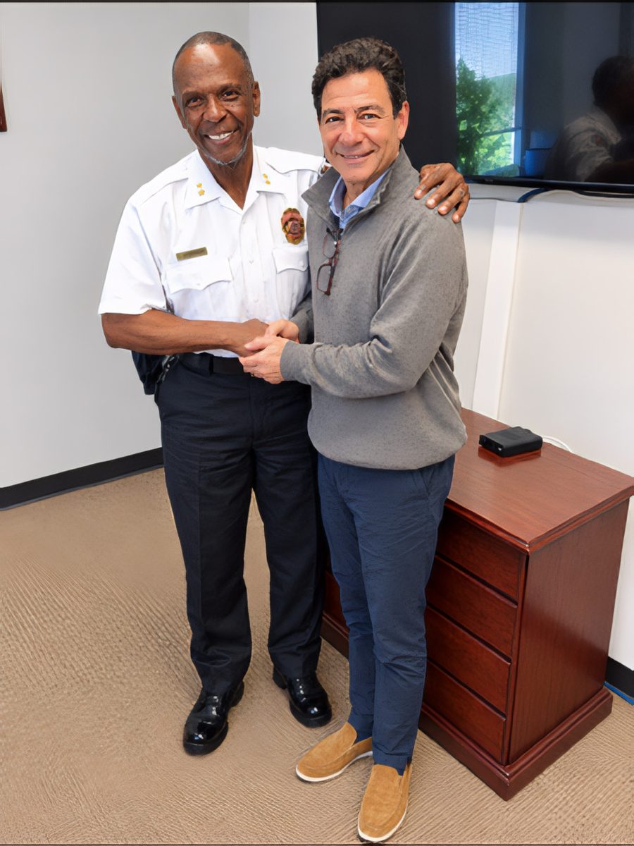 Prince George's County Department of Corrections Director Rodney Brockenbrough shaking hands with CBH Medical President Emre Umar